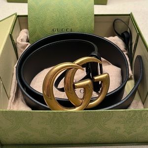 Authentic Gucci black leather women’s belt with gold buckle.Size small. Like new